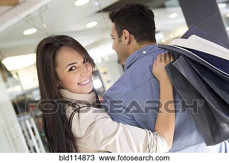 Stock Image - Hispanic couple shopping together. Fotosearch