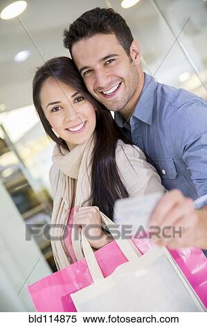 Stock Photography - Hispanic couple shopping together. Fotosearch