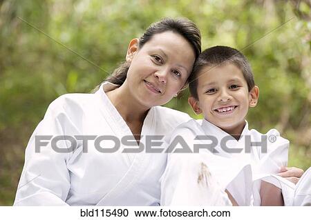 Hispanic mother and son wearing martial arts robes View Large Photo Image Stock Image - Hispanic mother and son wearing martial arts robes. Fotosearch