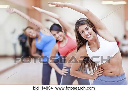 Hispanic women taking exercise class in gym View Large Photo Image Picture - Hispanic women taking exercise class in gym. Fotosearch