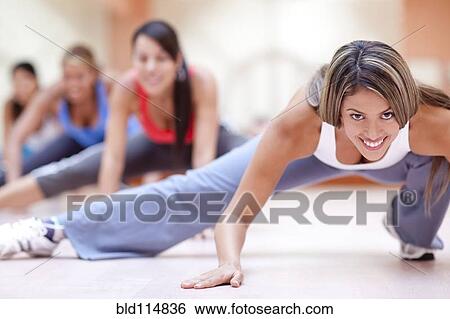 Hispanic women taking exercise class in gym View Large Photo Image Stock Photograph - Hispanic women taking exercise class in gym. Fotosearch