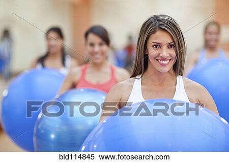 Hispanic women using exercise balls in gym View Large Photo Image Stock Photography - Hispanic women using exercise balls in gym. Fotosearch