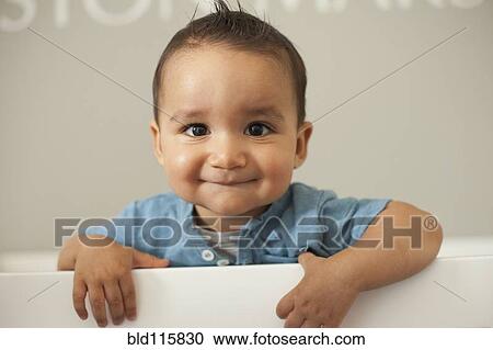 Stock Image - Mixed race baby smiling. Fotosearch
