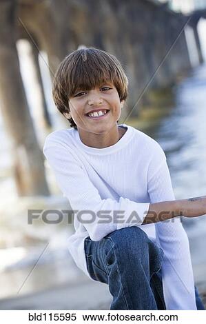 Mixed race boy smiling View Large Photo Image Stock Photography - Mixed race boy smiling. Fotosearch