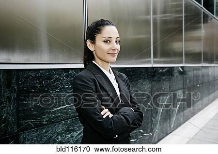 Mixed race businesswoman standing outdoors View Large Photo Image Stock Image - Mixed race businesswoman standing outdoors. Fotosearch