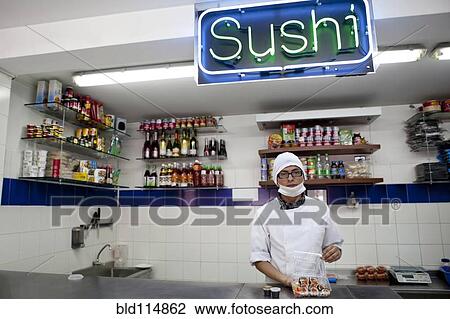 Mixed race chef working in sushi bar View Large Photo Image Stock Image - Mixed race chef working in sushi bar. Fotosearch