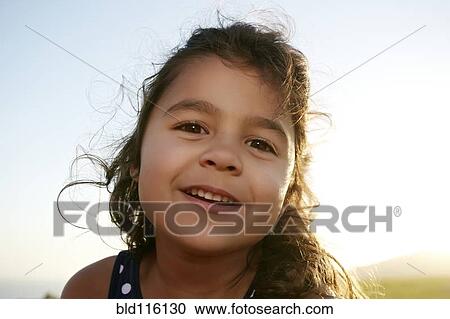 Mixed race girl smiling outdoors View Large Photo Image Stock Image - Mixed race girl smiling outdoors. Fotosearch