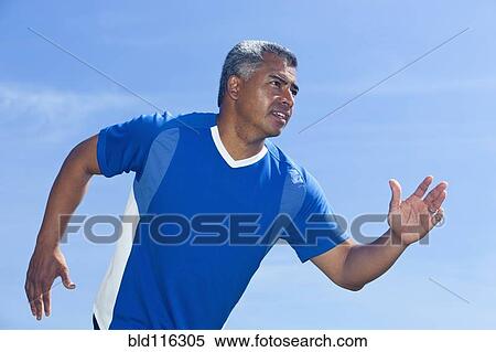 Mixed race man running outdoors View Large Photo Image Stock Photography - Mixed race man running outdoors. Fotosearch