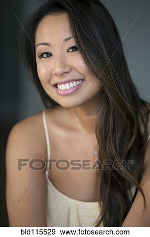 Stock Photo - Mixed race woman smiling. Fotosearch