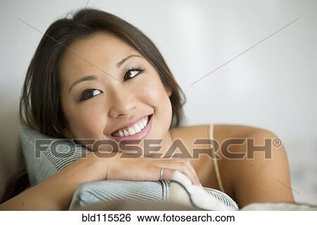 Mixed race woman smiling View Large Photo Image Stock Photograph - Mixed race woman smiling. Fotosearch