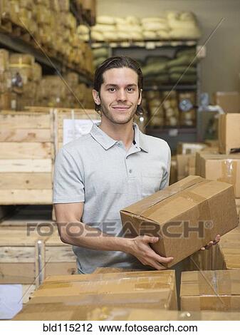 Mixed race worker stacking boxes in textile factory View Large Photo Image Stock Image - Mixed race worker stacking boxes in textile factory. Fotosearch