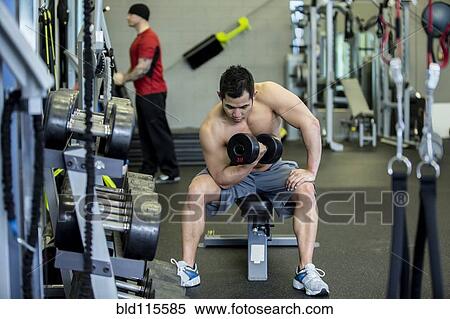 Pacific Islander man lifting weights in gym View Large Photo Image Stock Photography - Pacific Islander man lifting weights in gym. Fotosearch
