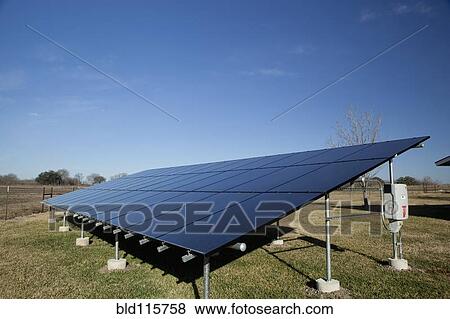 Stock Photo - Solar panels in rural field. Fotosearch