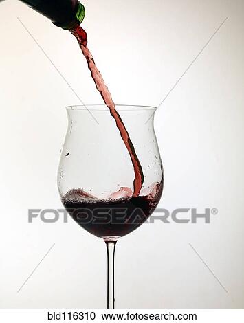 Stock Image - Wine pouring into glass. Fotosearch