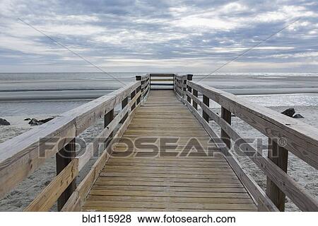 Stock Photo - Wooden pier over beach. Fotosearch