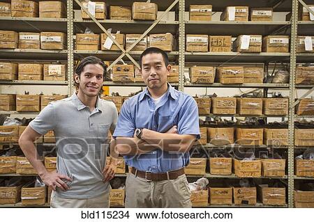 Workers smiling in textile factory View Large Photo Image Picture - Workers smiling in textile factory. Fotosearch