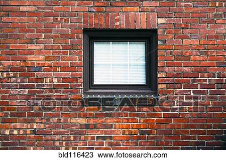 A brick wall with a small square window View Large Photo Image Stock Image - A brick wall with a small square window. Fotosearch