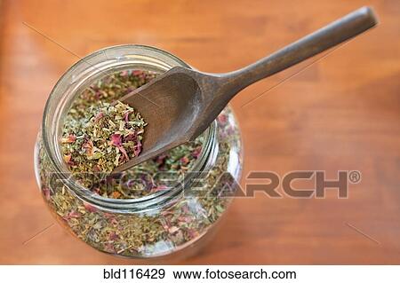 A glass jar and wooden scoop spoon View Large Photo Image Stock Photo - A glass jar and wooden scoop spoon. Fotosearch