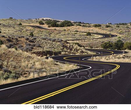 A newly paved winding road up a slight slope View Large Photo Image Picture - A newly paved winding road up a slight slope . Fotosearch