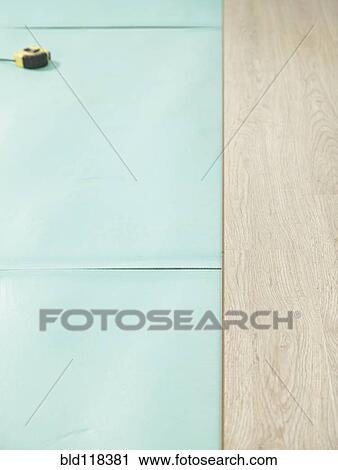 A room with partly installed laminate flooring View Large Photo Image Stock Image - A room with partly installed laminate flooring. Fotosearch