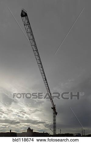 A tower crane in New Orleans, Louisiana against a gray stormy sky View Large Photo Image Picture - A tower crane in New Orleans, Louisiana against a gray stormy sky. Fotosearch