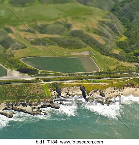 Aerial View of a Coastal Road and Valley View Large Photo Image Picture - Aerial View of a Coastal Road and Valley. Fotosearch