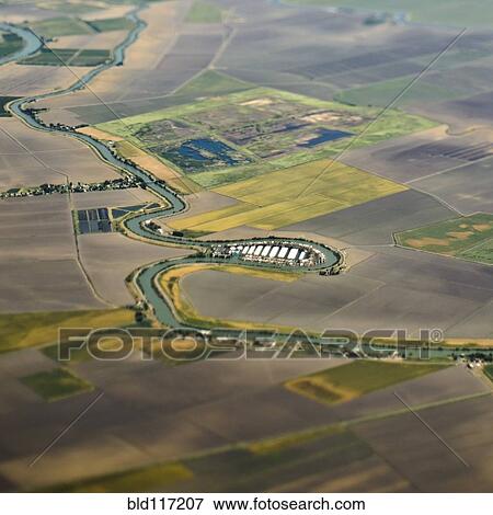 Stock Photo - Aerial View of a River Passing Through Farmland. Fotosearch