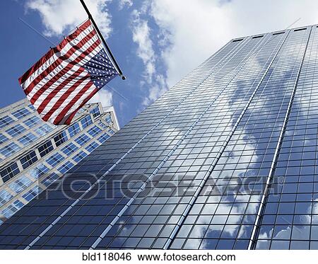 Stock Photograph - American Flag Against Office Buildings. Fotosearch