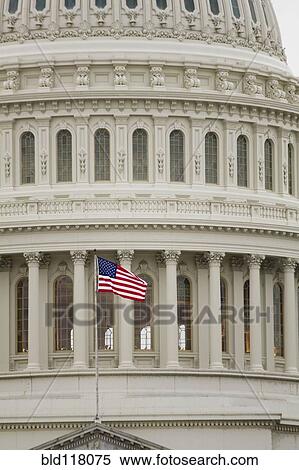Stock Photography - American Flag on the Capitol Building. Fotosearch