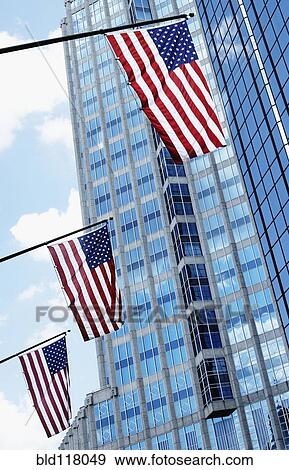 Stock Photo - American Flags Against Office Buildings. Fotosearch