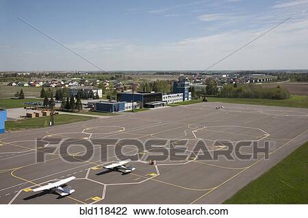 Stock Image - An elevated view over the airport apron and taxiway. Fotosearch