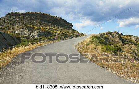 An empty road leading uphill in the middle of the Tabernas desert View Large Photo Image Stock Photography - An empty road leading uphill in the middle of the Tabernas desert. Fotosearch