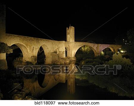 Stock Photo - Ancient Stone Bridge At Night. Fotosearch
