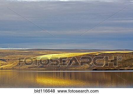 Barren Cliff Face Reflected in Water View Large Photo Image Stock Photo - Barren Cliff Face Reflected in Water. Fotosearch