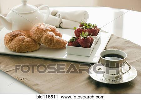 Stock Image - Breakfast Setting on Table. Fotosearch