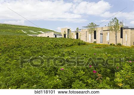 Stock Image - Building In Green Field. Fotosearch