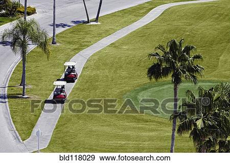 Carts on a Golf Course View Large Photo Image Stock Photo - Carts on a Golf Course. Fotosearch
