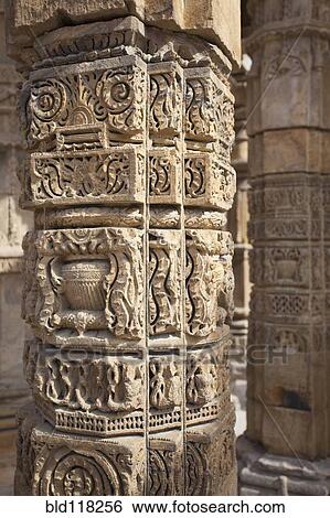 Stock Photograph - Carved Pillars in the Qutub Complex. Fotosearch