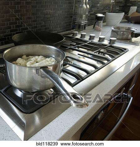 Stock Photo - Cauliflower Cooking on the Stove. Fotosearch