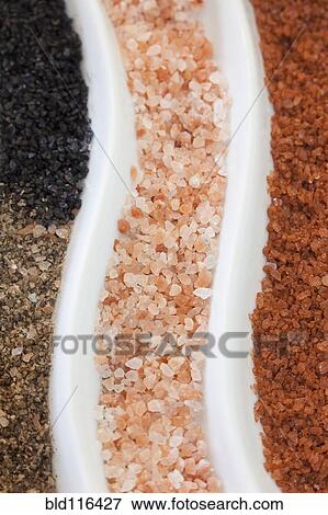 Close up of a pattern of colored salts and mineral compound View Large Photo Image Stock Photo - Close up of a pattern of colored salts and mineral compound. Fotosearch