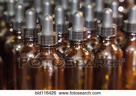 Stock Photograph - Close-up of dropper bottles in a traditional apothecary shop. Fotosearch