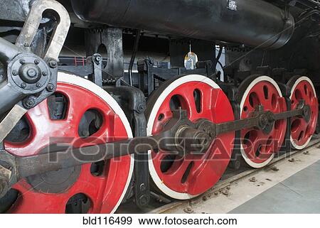 Close up of the rows of steel wheels of a locomotive train View Large Photo Image Stock Photo - Close up of the rows of steel wheels of a locomotive train. Fotosearch