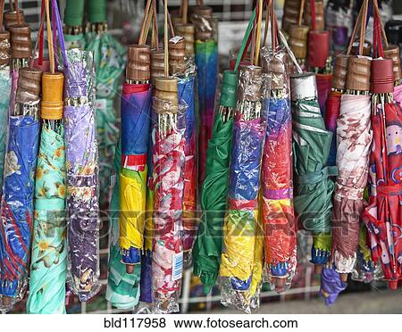 Collapsible Umbrellas Hanging in a Store View Large Photo Image Stock Photo - Collapsible Umbrellas Hanging in a Store. Fotosearch