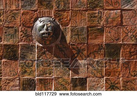 Stock Photo - Colorful Tiles and Lion Face Fountain. Fotosearch