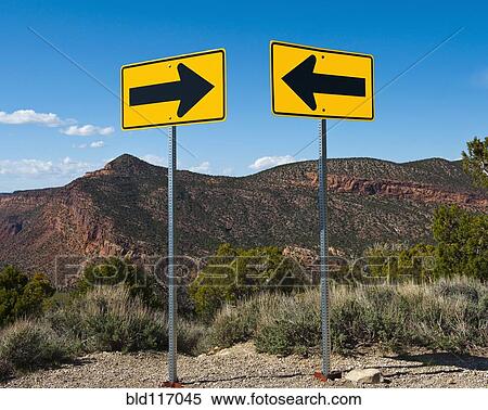 Stock Photography - Contradictory Road Signs. Fotosearch
