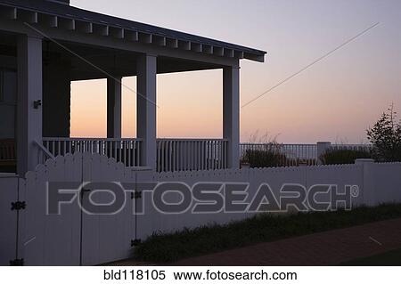 Covered Porch And Fence At Sunset View Large Photo Image Stock Photography - Covered Porch And Fence At Sunset. Fotosearch