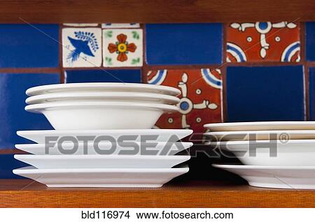 Dishes in Front of Colorful Tile View Large Photo Image Picture - Dishes in Front of Colorful Tile. Fotosearch