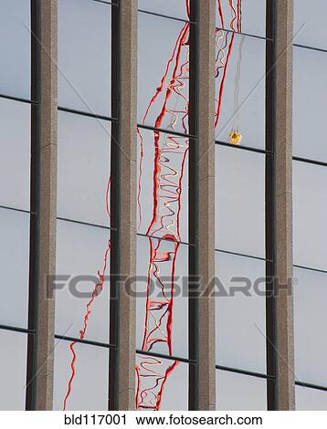 Stock Image - Distorted Reflection of a Tower Crane. Fotosearch