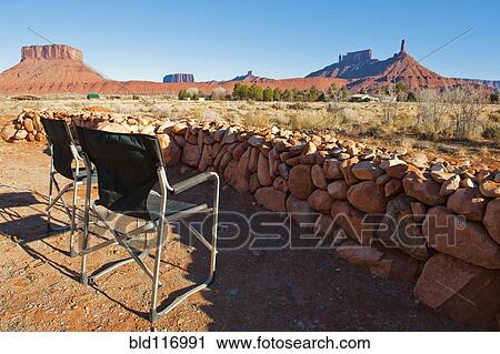 Stock Image - Empty Chairs Looking Across the Desert. Fotosearch