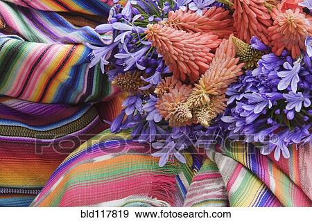 Stock Photo - Flowers on a Colorful Tapestry. Fotosearch